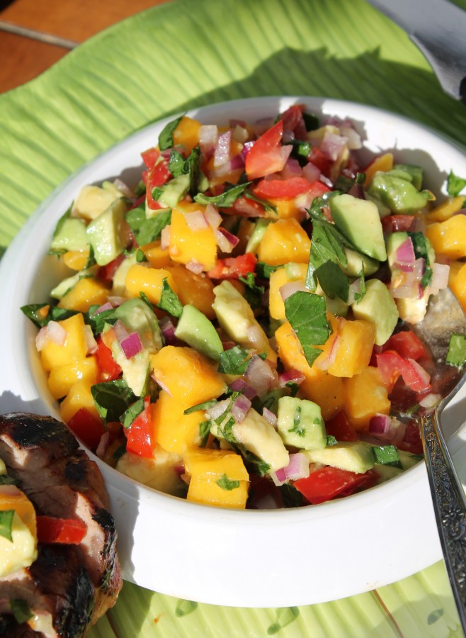 Pork tenderloin with mango-avocado salsa - a quick and colourful summer meal that can be grilled or done in the oven! Recipe on hiddenponies.com