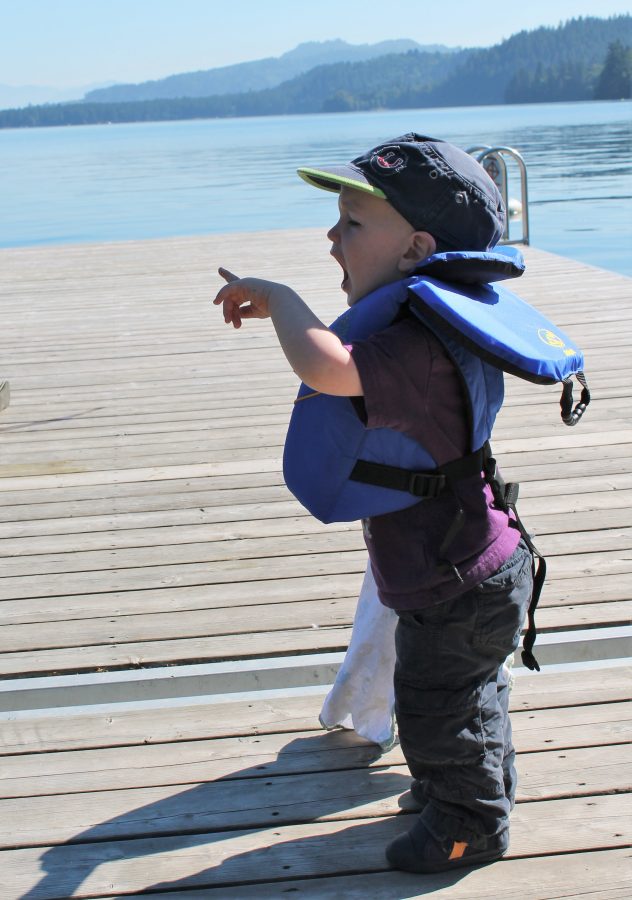 Shouting directions and encouragement to the fishermen from a safe distance.